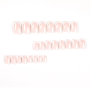 Short square press-on nails with classic pink base and white french tips on white background