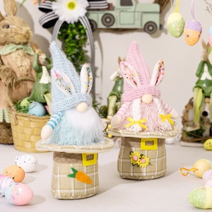 Detail of blue and pink Easter gnomes with rabbit ears and carrots in a festive setting