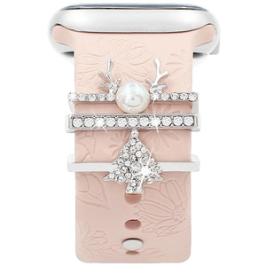 Close-up of pink silicone watch band with pearl reindeer and rhinestone tree charms