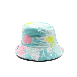 Reversible tie-dye bucket hat with blue, pink, and yellow ink splash street style print