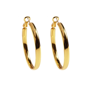 Minimalist large golden hoop earrings with a polished metallic finish on a white background