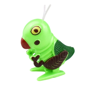 Funny wind-up clockwork green grasshopper toy with vivid wings on a clean white background