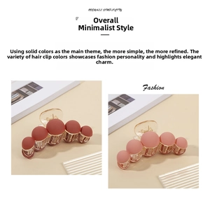 Close-up of matte sphere hair claw clips in dusty rose and deep bean red finish