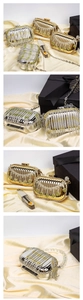 Detail of luxury acrylic evening clutch with sparkling rhinestones and metal tassels