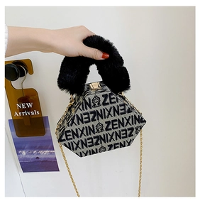 Close-up of hexagonal jacquard bag with ZENXIN print and black faux fur handle