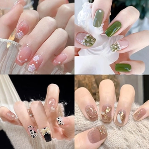 Press-on nail set featuring bow, pearl, and heart designs in four aesthetic styles