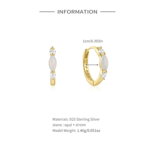 Detail view of gold S925 silver hoop earrings with opal and cubic zirconia inlay