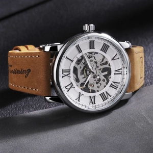 Men's skeleton mechanical watch with silver case, roman numerals and brown leather strap
