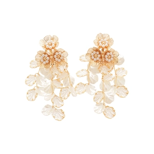Elegant gold flower earrings with pearls and white shell tassel petals on white background