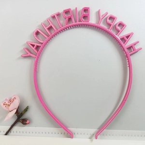Pink Happy Birthday headband with 3D letters for party accessories on a white surface