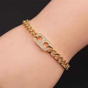 Elegant gold-plated cubic zirconia adjustable chain bracelet worn on a woman's wrist