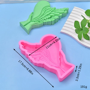 Silicone mold with wings and heart design for soap and candle making, size 17.5x11x3.3cm