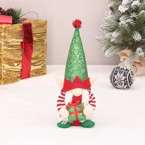 Christmas gnome ornament with green sequin hat, striped sleeves and gift box decor