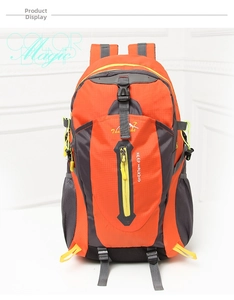 Detail of orange outdoor backpack with side mesh pockets and adjustable buckles