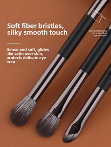 Detail of dual-ended eyeshadow brushes with soft synthetic bristles and matte black handles