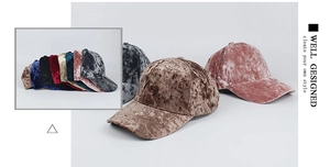 Detail of velvet baseball caps in various colors showing soft texture and premium luster