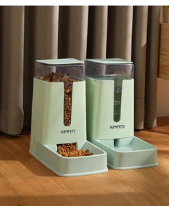 Detail view of KIMPETS gravity pet feeder and waterer set with transparent containers
