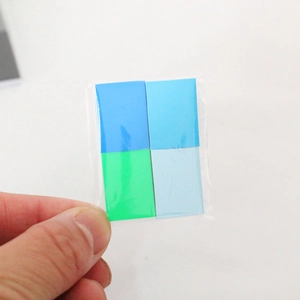 Detail of colorful dollhouse paper cards in transparent packaging for 1:12 miniature scenes