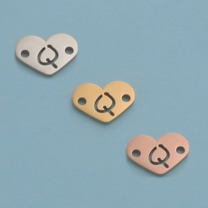 Macro detail of 12mm mirror heart pendants in silver, gold and rose gold finishes