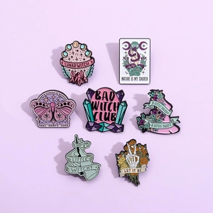 Detailed close-up of 7-piece mystical enamel pins featuring tarot cards and moon phases