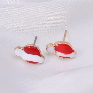 Detailed view of red and white enamel Christmas hat stud earrings with golden trim