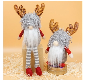 Detail of Christmas gnomes with reindeer antlers, felt textures and knitted long legs