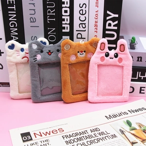 Set of four plush cartoon animal card holders in cream, grey, brown and pink with hooks