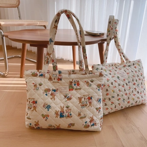 Quilted cotton tote bag with vintage bear and rabbit prints in cream beige color