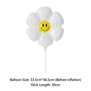 Detail view of daisy flower balloon with smiley face showing 33.5cm by 36.5cm dimensions