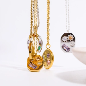 Detail of assorted U-shaped lucky charm necklaces with colorful zirconia stones