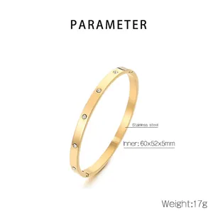 Detailed view of gold stainless steel bangle with inlaid zircons and product dimensions