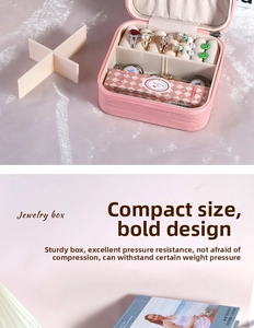 Detailed internal view of portable pink PU jewelry box with zipper and ring storage slots