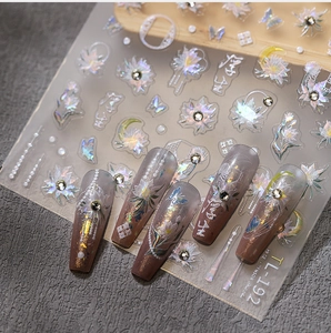Detailed 5D embossed nail art stickers with Chinese floral patterns and pearl accents