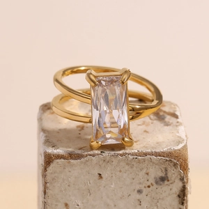 Double-layered 18K gold plated ring with a large rectangular clear gemstone on stone