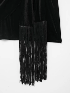 Detailed close-up of long fringe trim on a luxury black velvet mini dress for women