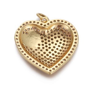 Detailed back view of a golden heart zircon pendant with intricate hollow pattern