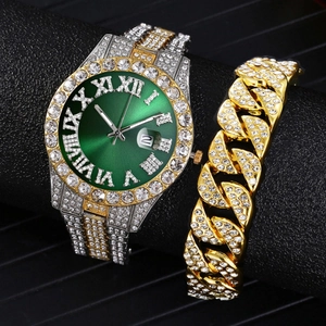 Close-up of hip hop luxury watch set featuring green dial and gold cuban link bracelet