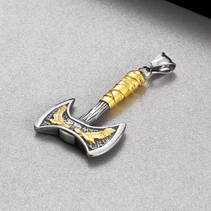 Detailed view of Viking raven axe pendant with silver blade and golden handle textures