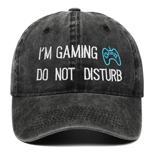 Detail of gaming embroidery on washed cotton baseball cap with Do Not Disturb text