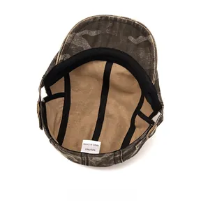 Detail view of the camo army cap interior showing reinforced stitching and care label