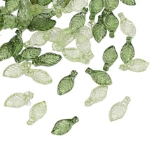 Detailed macro of green leaf-shaped acrylic beads for DIY jewelry and crafts making