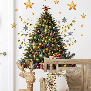Detail of Christmas tree wall decal set on white wall with festive gift box elements