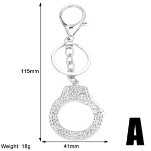 Detail view of silver handcuffs keychain with rhinestones and full size dimensions