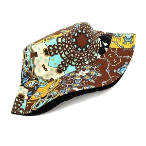 Detail of reversible bucket hat with ethnic mandala pattern and colorful geometric print