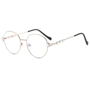 Chic rose gold round frame sunglasses with leaf-shaped crystal embellishments