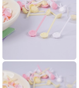 Close-up of colorful mini long-handle plastic spoons with octagonal heads for dollhouses