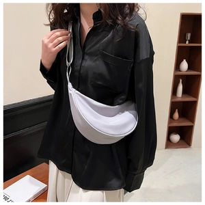 Detailed shot of lightweight nylon crescent bag with adjustable wide strap and zipper detail