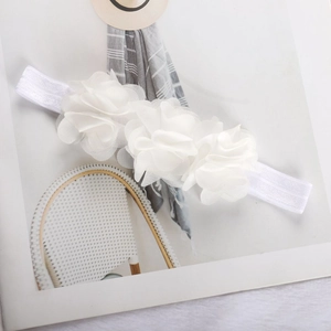 Detail of three white chiffon flowers and high-elasticity band for baby girls