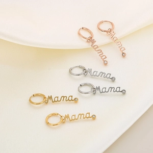 Diamond-studded Mama letter pendant earrings set in gold, silver, and rose gold finishes