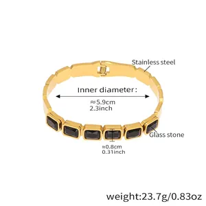 Detailed view of gold stainless steel bangle with black glass stones and dimensions
